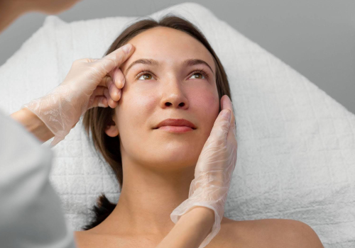 Close-up of pimple scars on a person's face